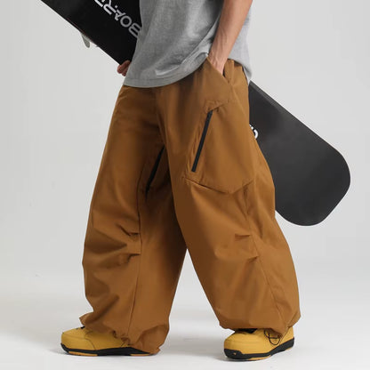 Men's and women's waterproof ski pants in loose fit, windproof snowboard snow pants